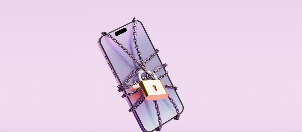 Smartphone on lilac background wrapped in chain and padlocked