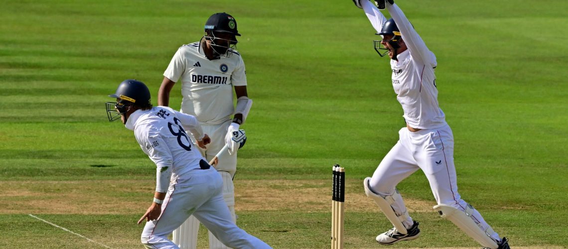 England's Ollie Pope (L) celebrates winning on the fifth day of the third cricket test match between England and India at Lord's cricket ground in London, on July 14, 2025