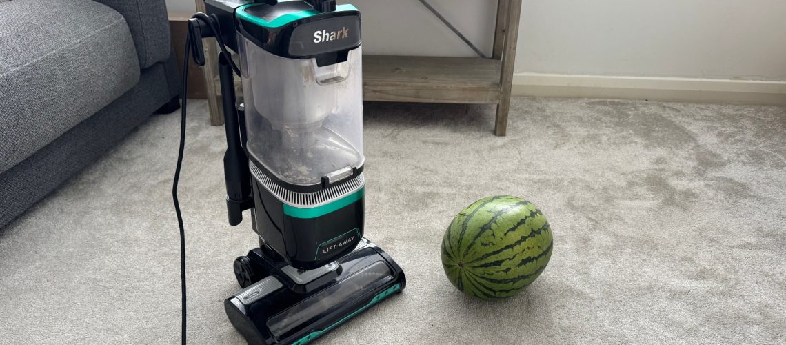 A watermelon next to a vacuum