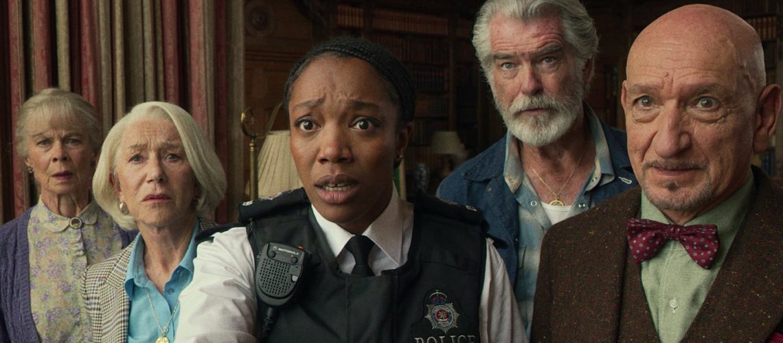 L-R: Celia Imrie, Helen Mirren, Naomi Ackie, Pierce Brosnan, Ben Kingsley stand together in a scene from Netflix's "The Thursday Murder Club" movie