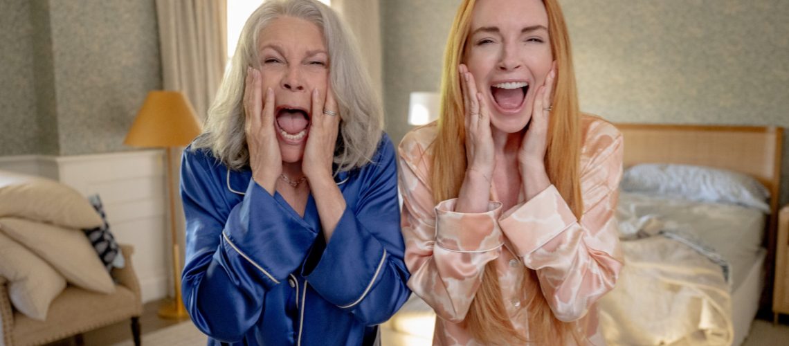 L-R: Tess (Jamie Lee Curtis) and Anna (Linsday Lohan) standing side-by-side and screaming in their in PJs in a scene from "Freakier Friday"