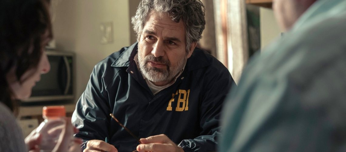 Mark Ruffalo sits across a table from some civilians in a scene from HBO Max's "Task"