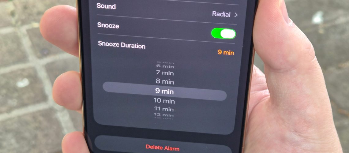 Photo of iOS 26 Clock app with wheel of snooze options