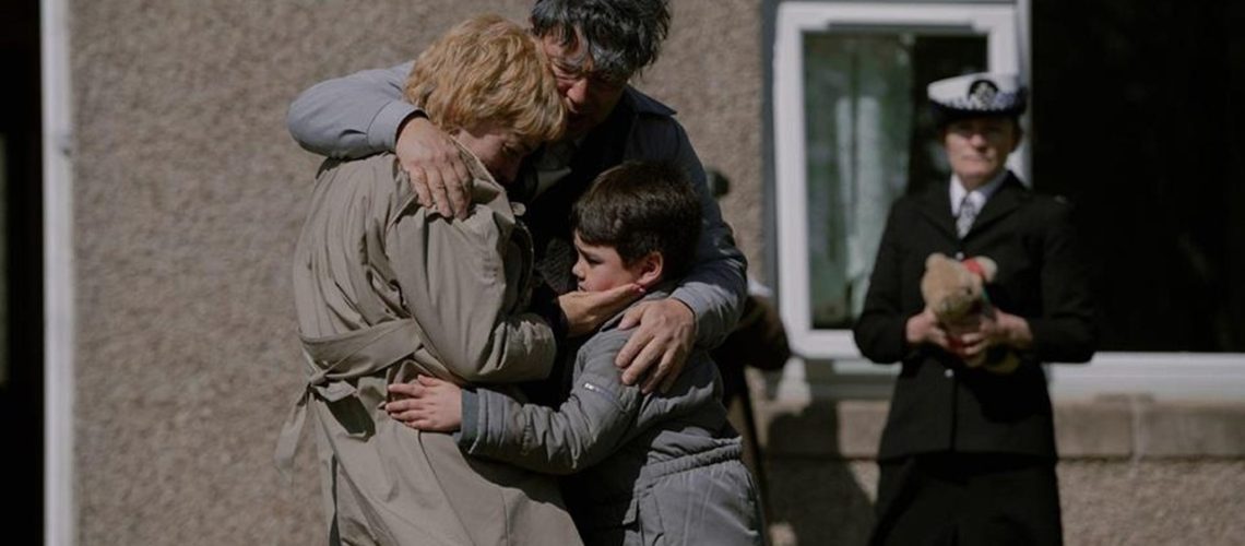 Ann (Sheridan Smith) and her husband Charlie Ming (Daniel York Loh) embrace each other and their grandson after receiving some devastating news as a policewoman looks on in "I Fought the Law".