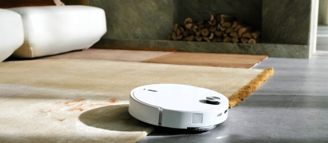 Roborock Qrevo Curv 2 Pro transitioning between a rug and hard floor