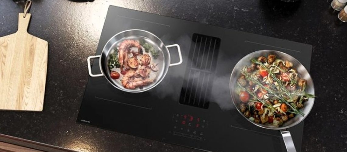Two pans being used on Samsung's cooktop with integrated extractor fan