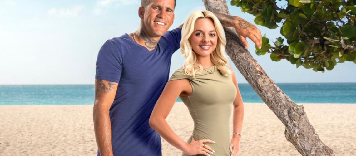 Johny &amp; Chloe posing on a beach in a promotional image for ’90 Day Fiance: The Other Way' season 7.