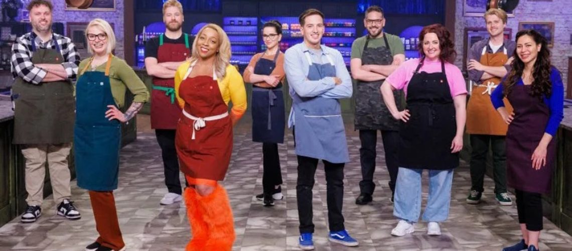 The 10 contestants of the 'Halloween Baking Championship' season 11 line up in the kitchen.