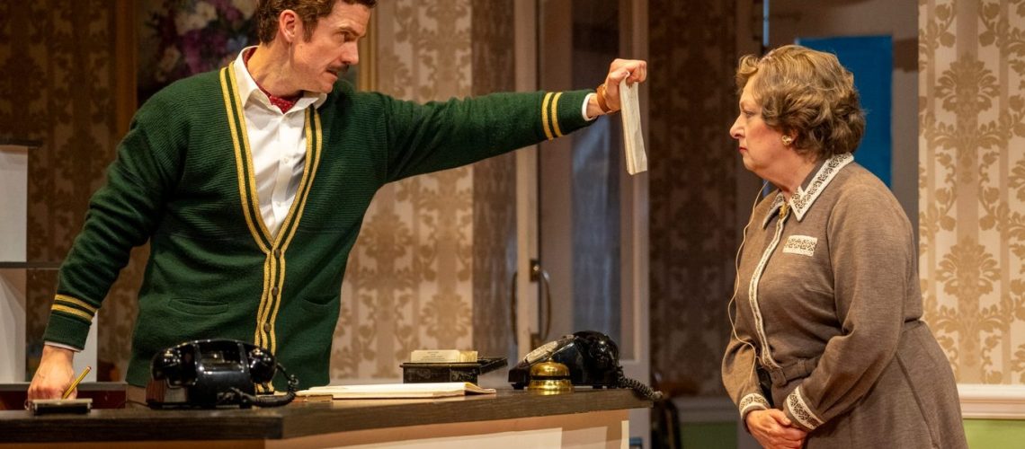 Basil Fawlty (played by Adam Jackson-Smith) has a one way conversation with Mrs Richards (Rachel Zen) in "Fawlty Towers: The Play" on U&amp;Gold TV