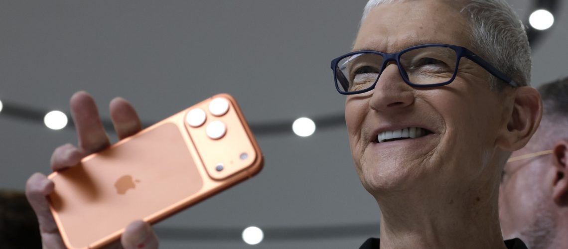 Tim Cook holding up an iPhone 17 Pro Max at launch event