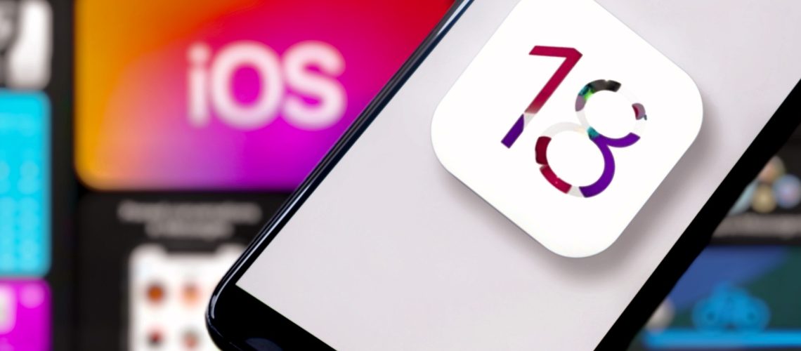 Unofficial iOS 18 logo on an iPhone