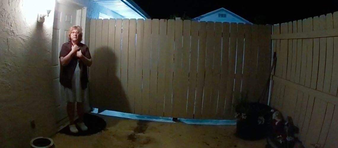 Susan Lorincz stands just outside the back door of her home, as seen on police body cam footage in the documentary "The Perfect Neighbor" on Netflix.