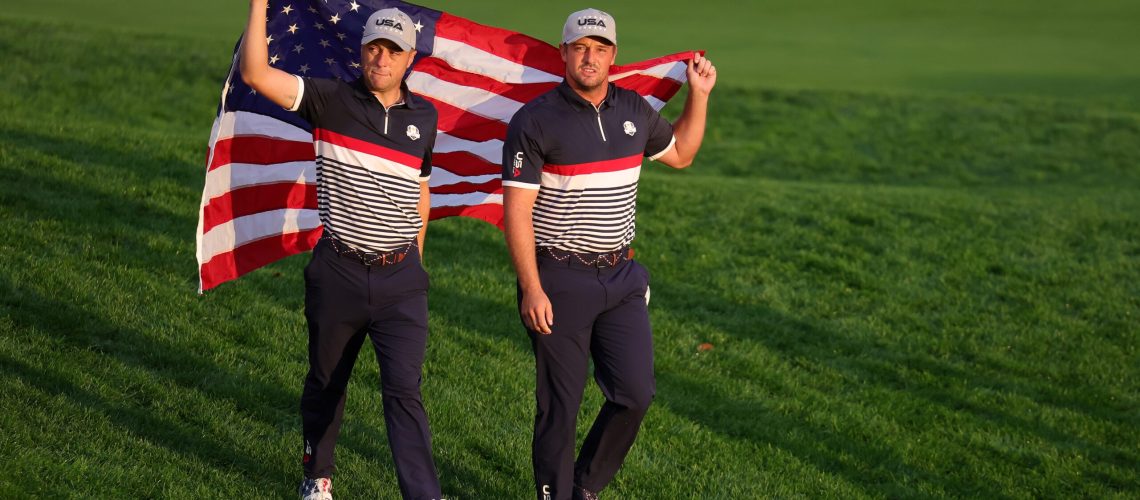 Justin Thomas and Bryson DeChambeau of Team United States walk to the first tee during the Friday morning foursomes matches of the 2025 Ryder Cup at Black Course at Bethpage State Park Golf Course on September 26, 2025 in Farmingdale, New York.