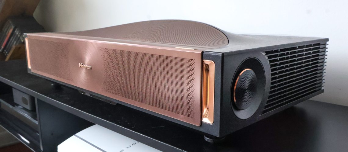 The Hisense L9Q UST projector in a living room