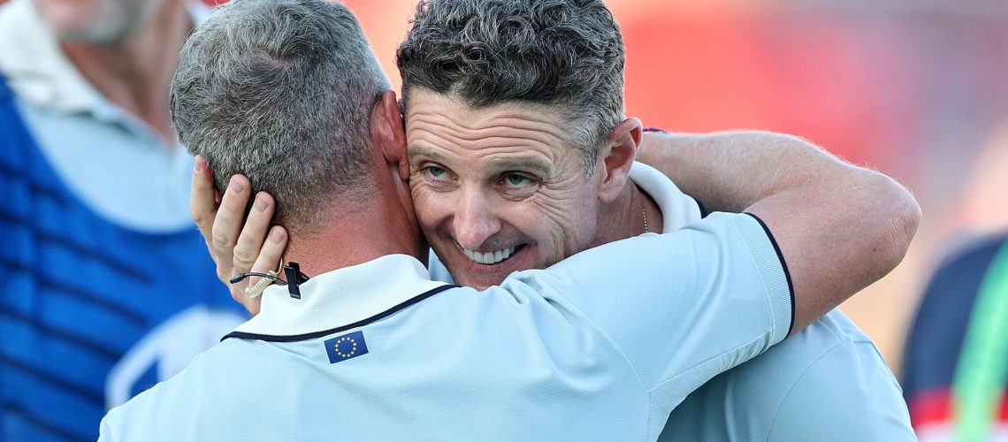 FARMINGDALE, NEW YORK - SEPTEMBER 26: Justin Rose of Team Europe celebrates with team captain Luke Donald after Rose and teammate Tommy Fleetwood defeated Bryson DeChambeau and Ben Griffin of Team United States, 1-up, during the Friday afternoon four-ball matches of the 2025 Ryder Cup at Black Course at Bethpage State Park Golf Course on September 26, 2025 in Farmingdale, New York. (Photo by Michael Reaves/PGA of America/PGA of America via Getty Images)
