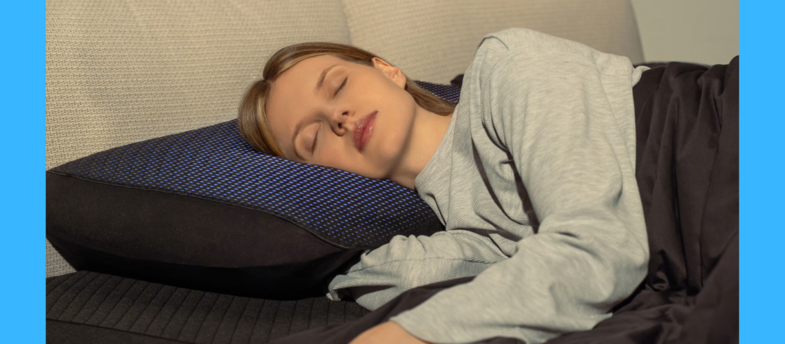 Woman sleeping on a pillow with the Eight Sleep Pod Pillow Cover on top