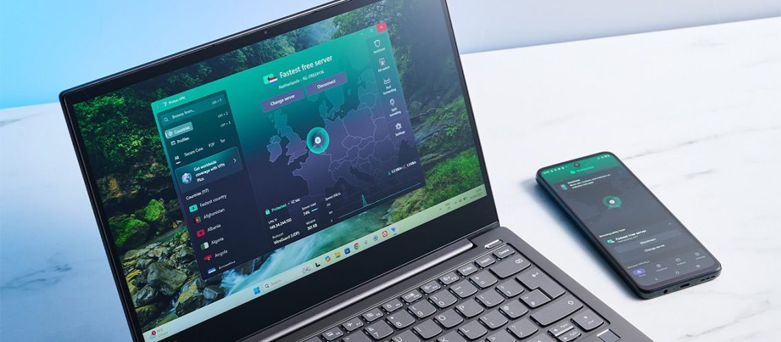 Laptop and smartphone on a table, both connected to Proton VPN Free