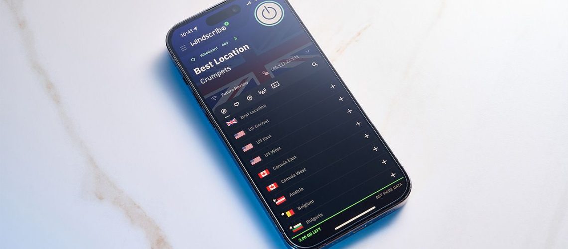 Windscribe VPN app open on an iPhone. The phone is laying down on a white, flat surface
