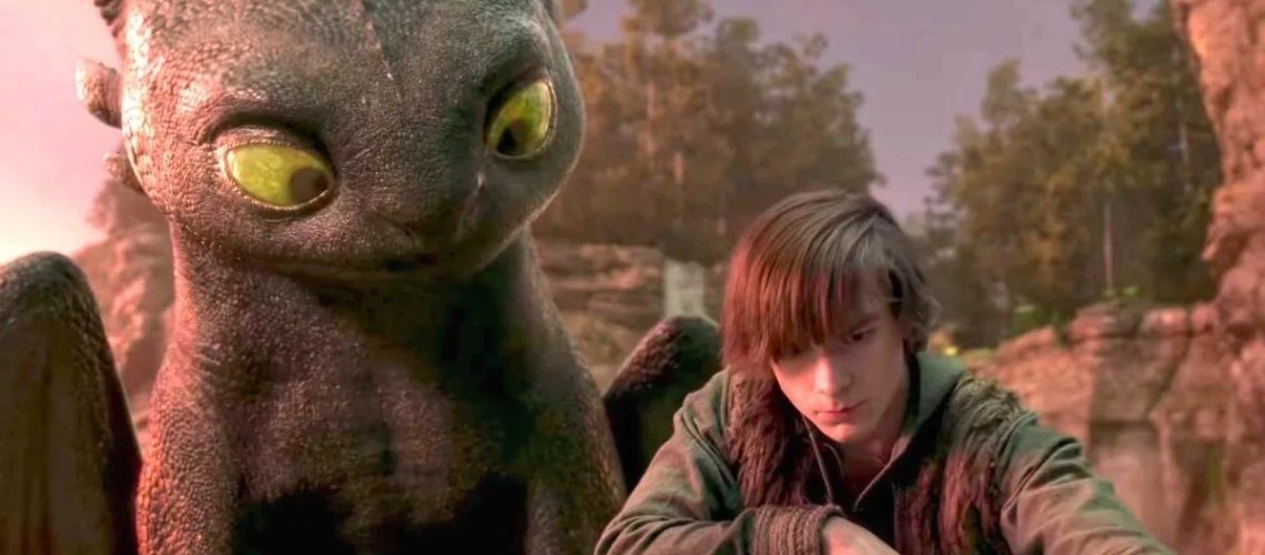 mason thames as hiccup beside CGI toothless in a cove in the 2025 how to train your dragon remake