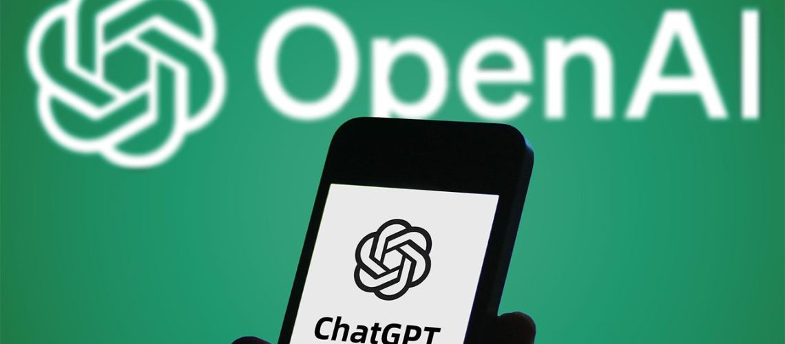 Smartphone displaying ChatGPT logo held in front of white OpenAI logo on green background