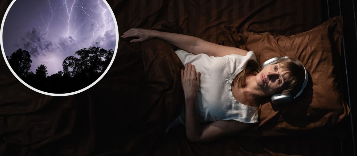 A woman sleeping on her back wearing white tshirt and overhead headphones in bed with brown bedding, with insert of storm clouds and lightning