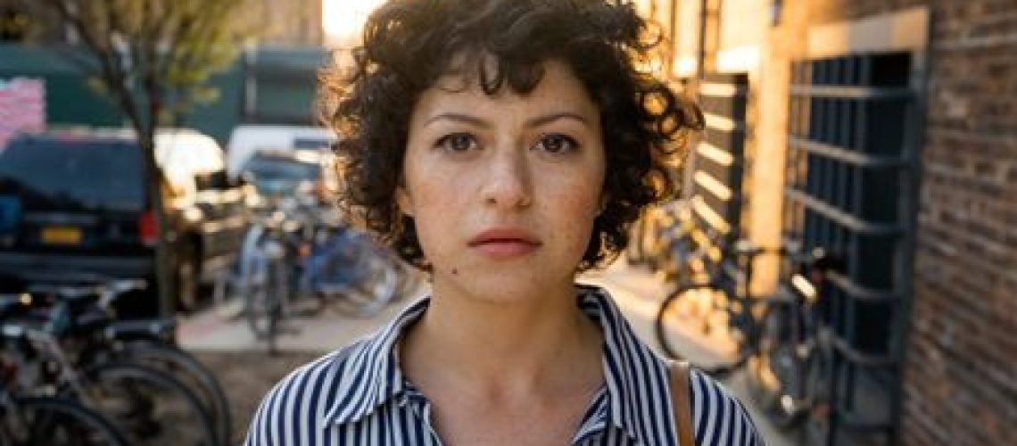 Dory (Alia Shawkat) looks down the lens in a promotional still for HBO Max's "Search Party"