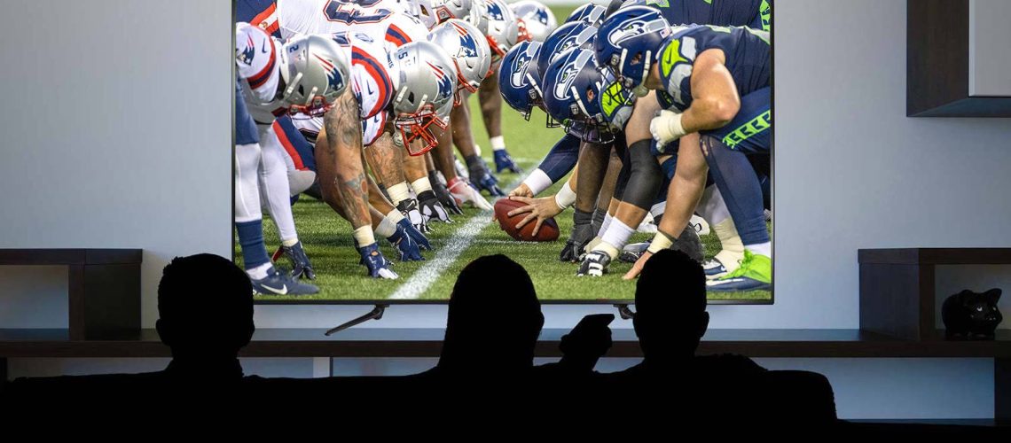 The Patriots vs the Seahawks on a TV.