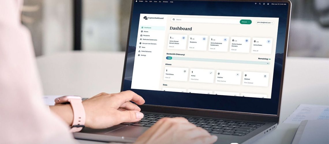 Person navigating the ExpressMailGuard dashboard on a laptop