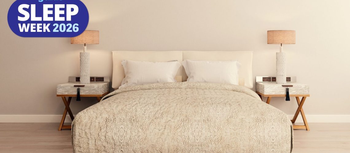 A serene bedroom setting, with neutral colors, matching nightstands, and warm golden-hour lighting.