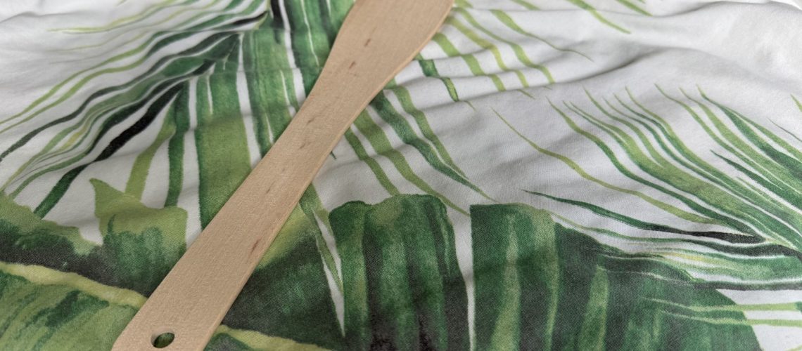 A spatula on a bed