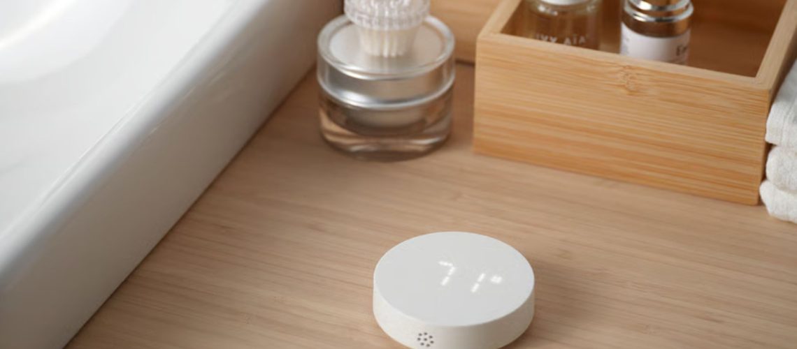 The IKEA TIMMERFLOTTE device next to a bathroom sink