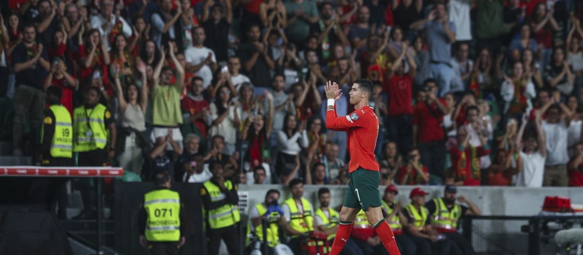 Portugal's Cristiano Ronaldo applauding fans while leaving the pitch