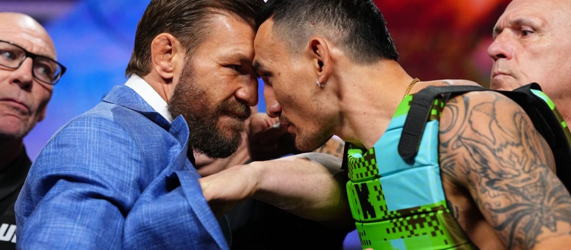 Conor McGregor and Max Holloway face off during the UFC 329 press conference at T-Mobile Arena in Las Vegas, Nevada.