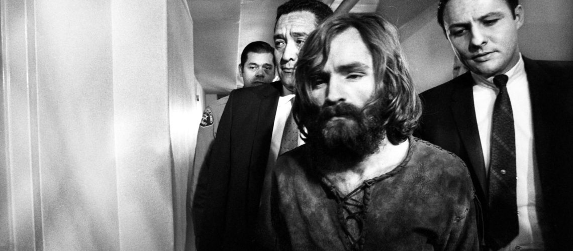 Charles Manson leaving court after deferring a plea on the Tate-LaBianca murder charges