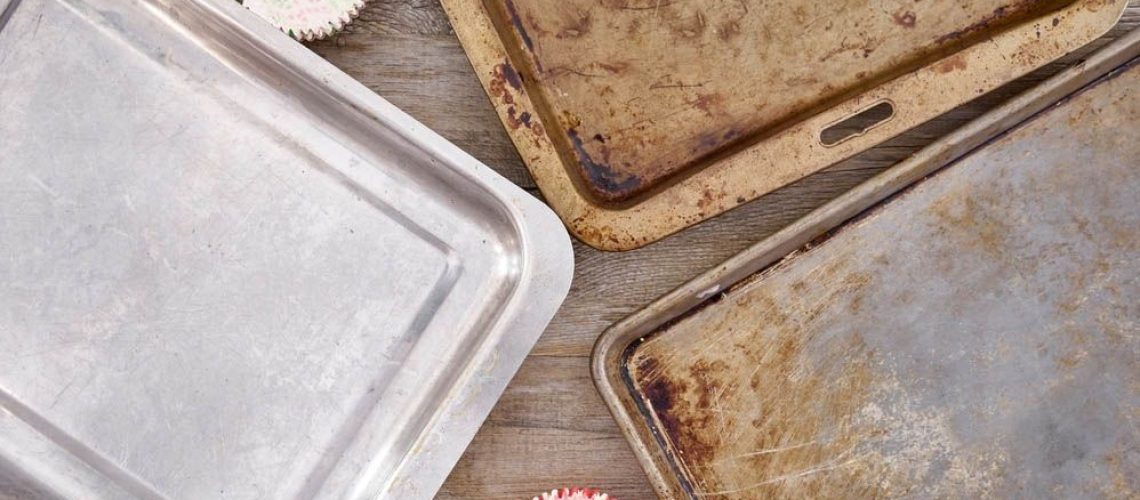 Several baking sheets on table
