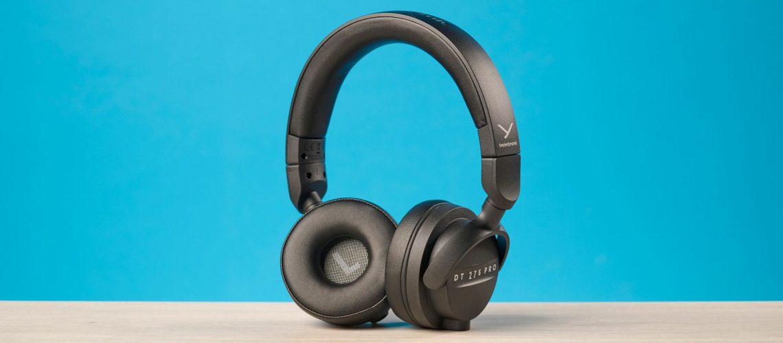 Beyerdynamic DT 275 Pro photographed in front of a blue background