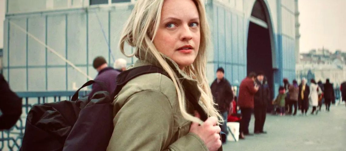 Elisabeth Moss looks over her shoulder in The Veil