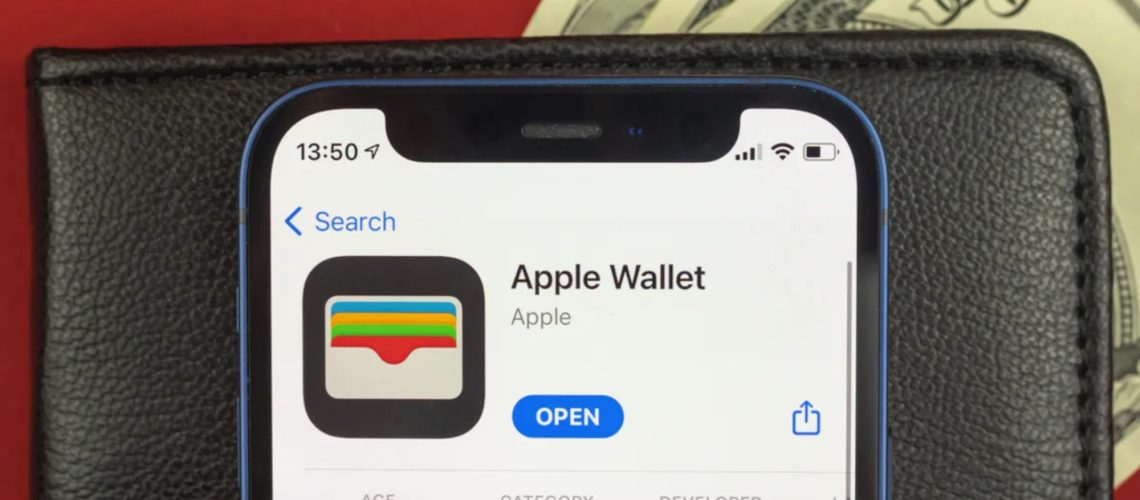 Apple wallet in front of a phone lying on a wallet