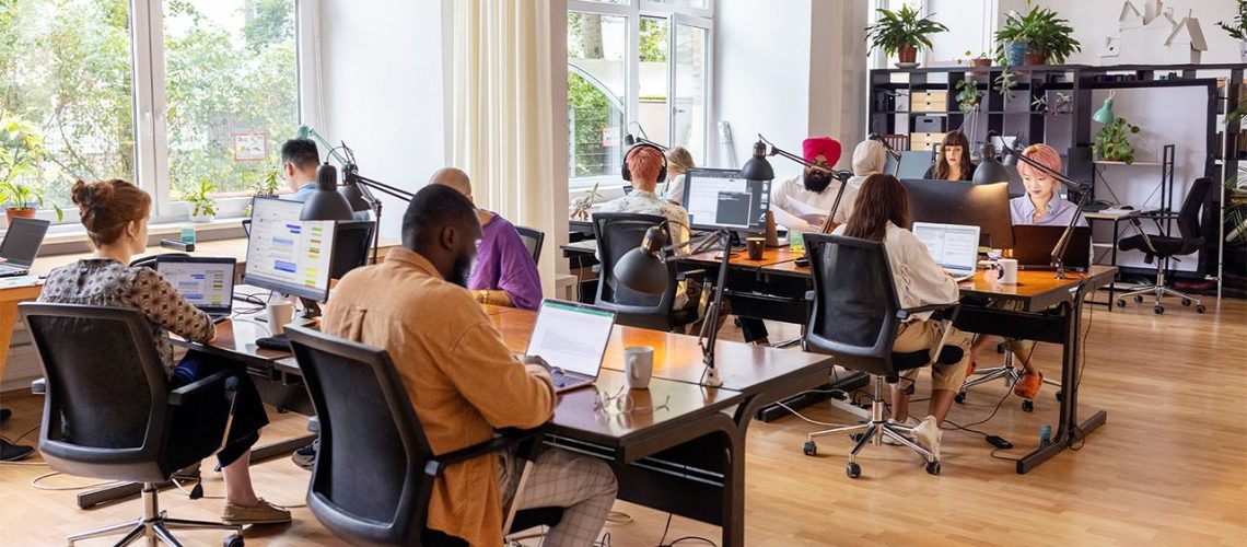 Employees working in open plan office