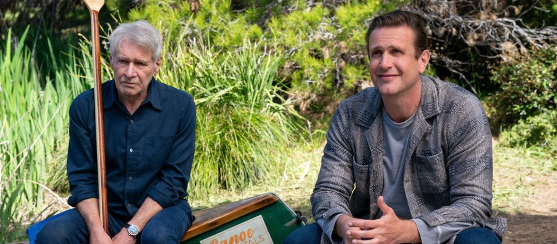 Paul (Harrison Ford) and Jimmy (Jason Segel) sitting outdoors side-by-side in "Shrinking" season 2