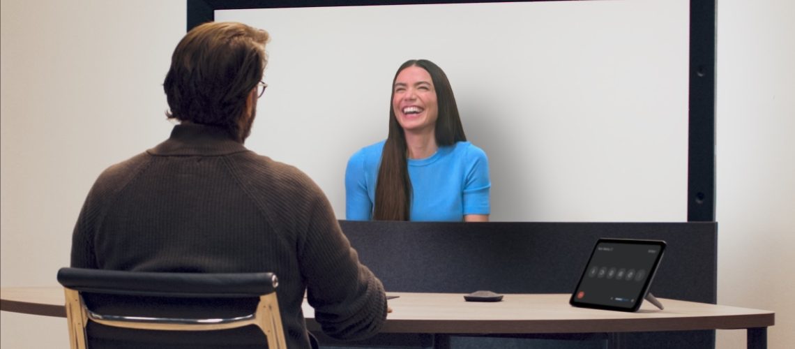 Two people having a 3D video chat with Google Beam