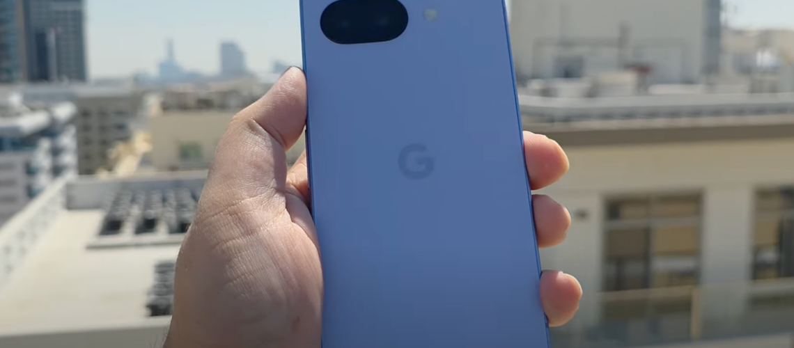 A YouTuber holding the leaked Pixel 9a