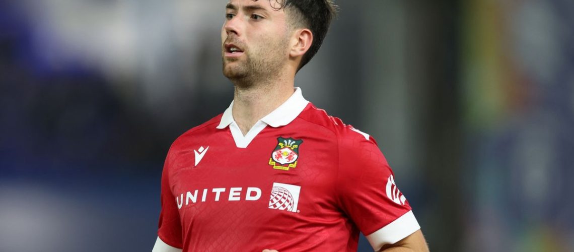 Thomas O'Connor of Wrexham AFC runs the pitch prior to the Harrogate Town vs Wrexham live stream in the FA Cup 2024