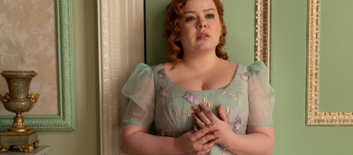 Penelope Featherington (Nicola Coughlan) standing against a wall in