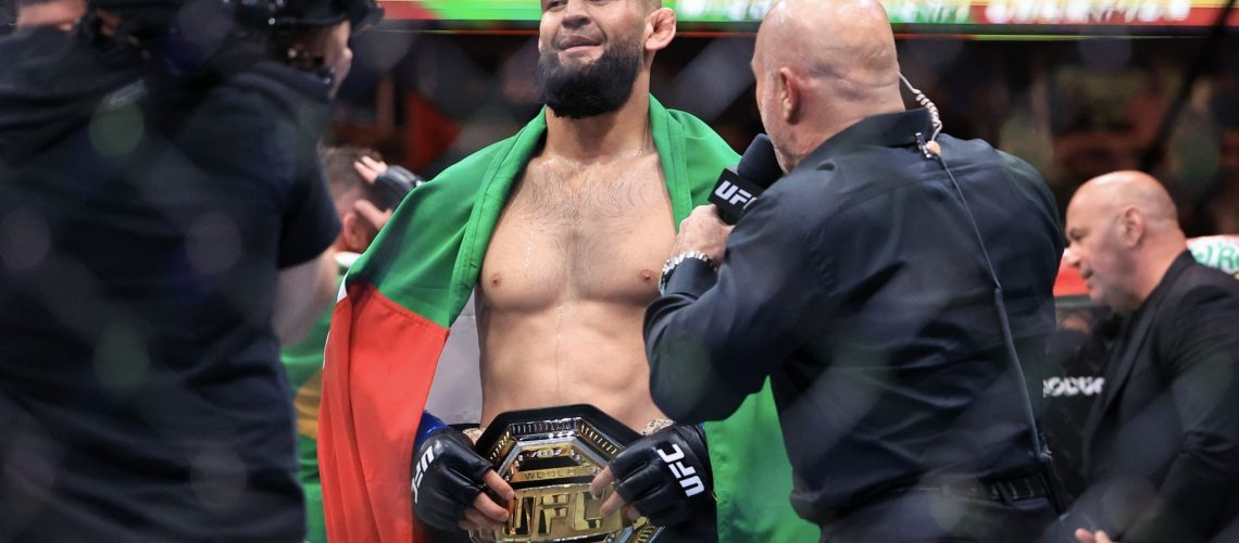 Khamzat Chimaev posing with the UFC middleweight belt