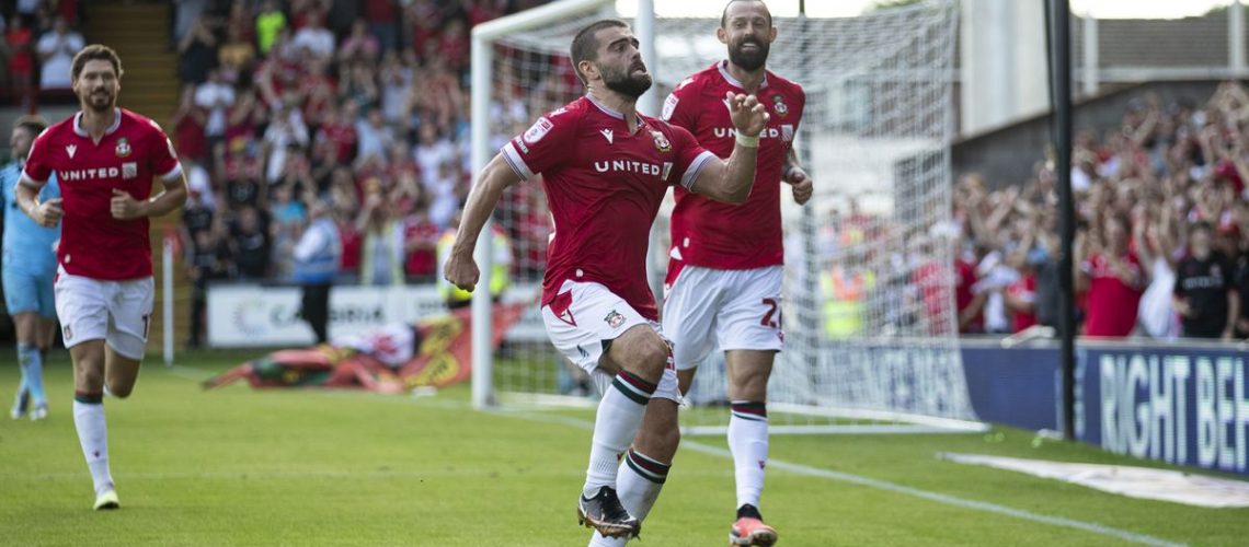 Elliot Lee celebrates a goal for Wrexham in the club