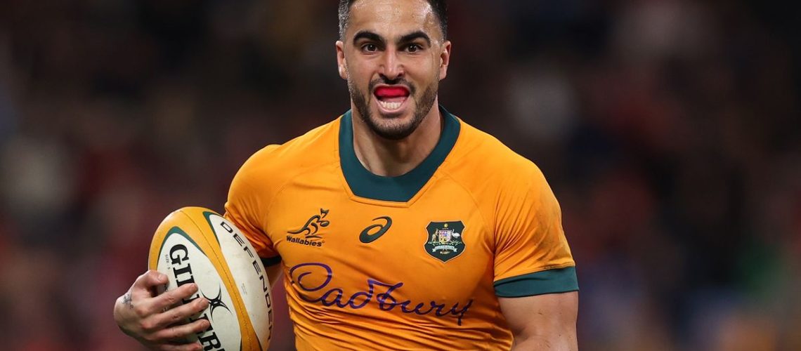 Tom Wright of the Wallabies runs the ball ahead of the Australia vs Wales live stream – rugby Summer Internationals 2024 second Test.