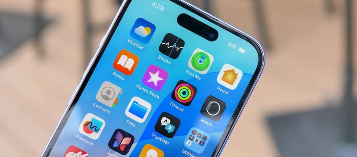 Apple iPhone 16 held in the hand.