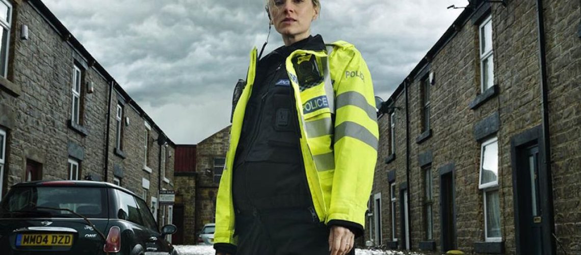 Sophie Rundle as PC Joanna Marshall standing in a flood street in a promotional photo for After the Flood