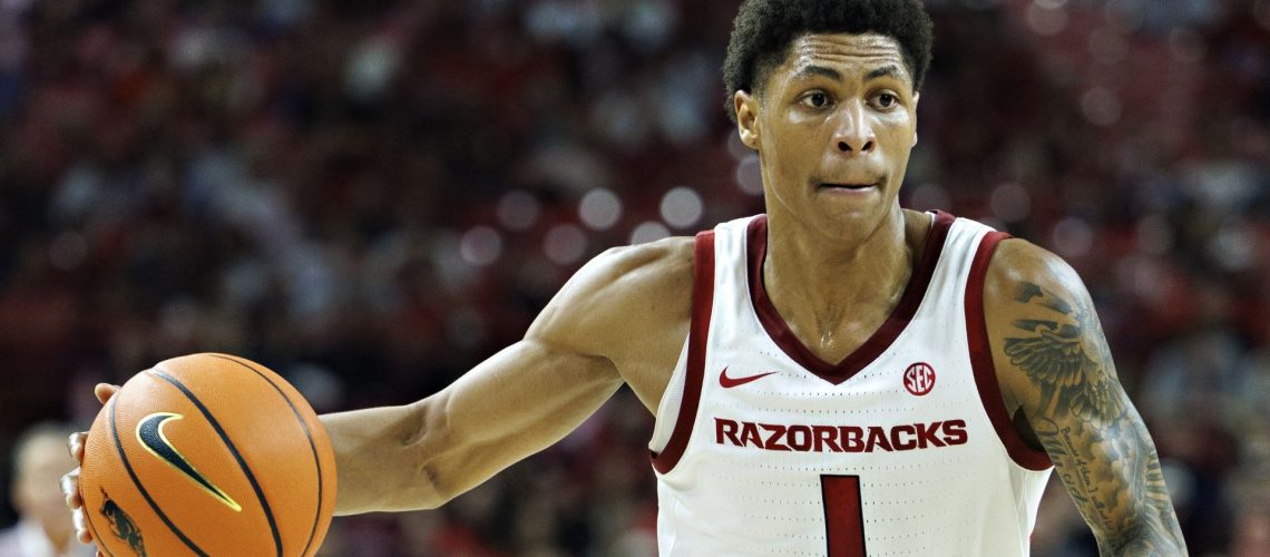 Meleek Thomas of the Razorbacks dribbling the ball ahead of the Duke vs Arkansas game